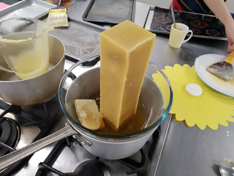 Melting a block of beeswax